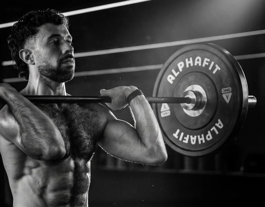 Jerry lifting a barbell in the gym